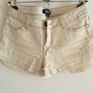 Low rise distressed jean shorts with lace pockets light tan color
